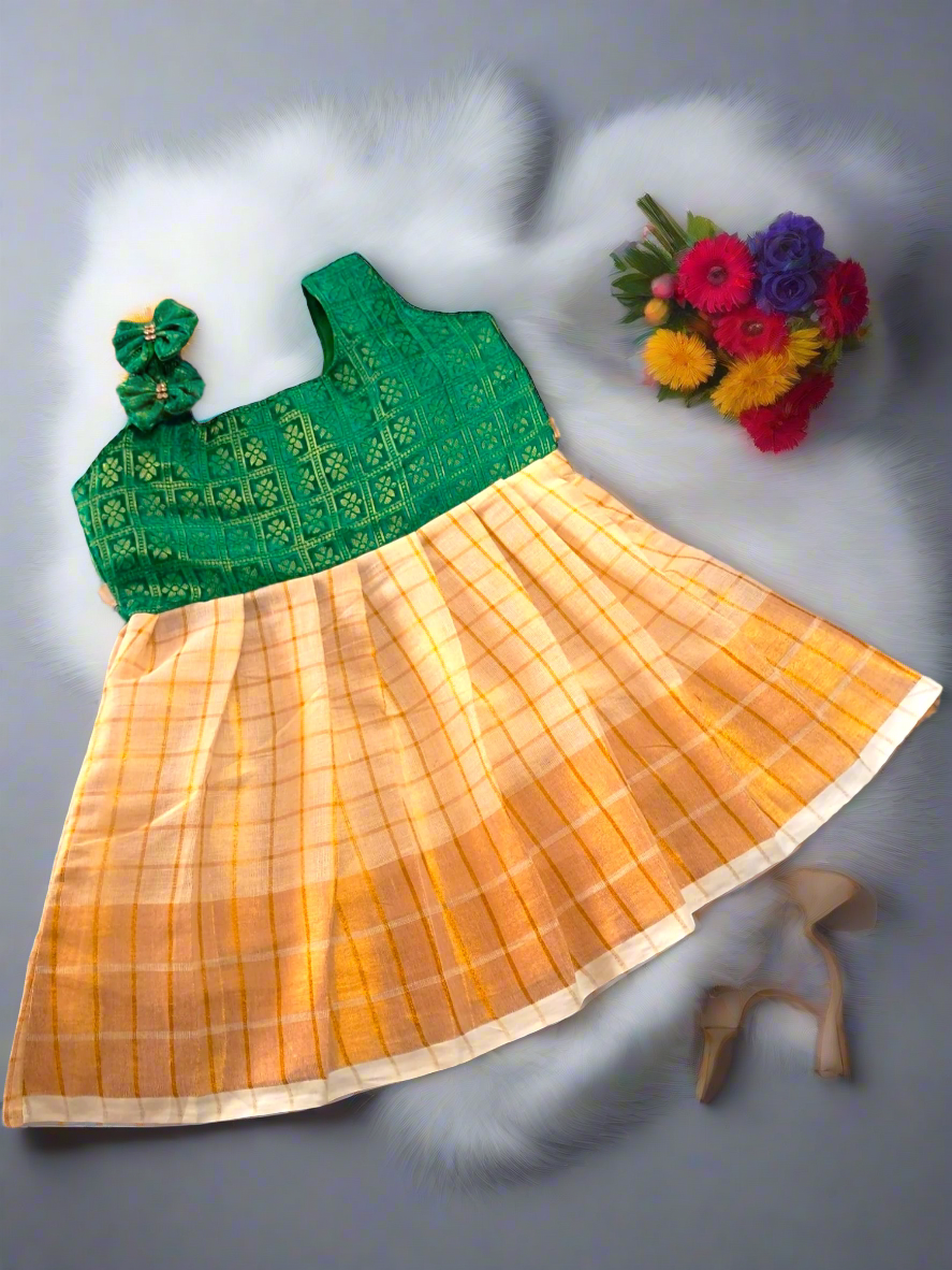 Kerala Kasavu tissue frock with Green Banarasi silk top, shoulder bows, and stone work - traditional kids ethnic wear for Onam and Diwali