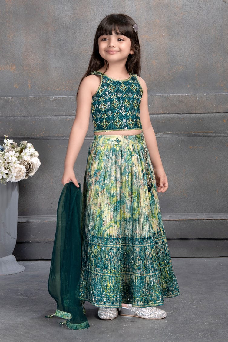 Little girl in green mirror work lehenga choli set with matching dupatta – Indian kids festive outfit.