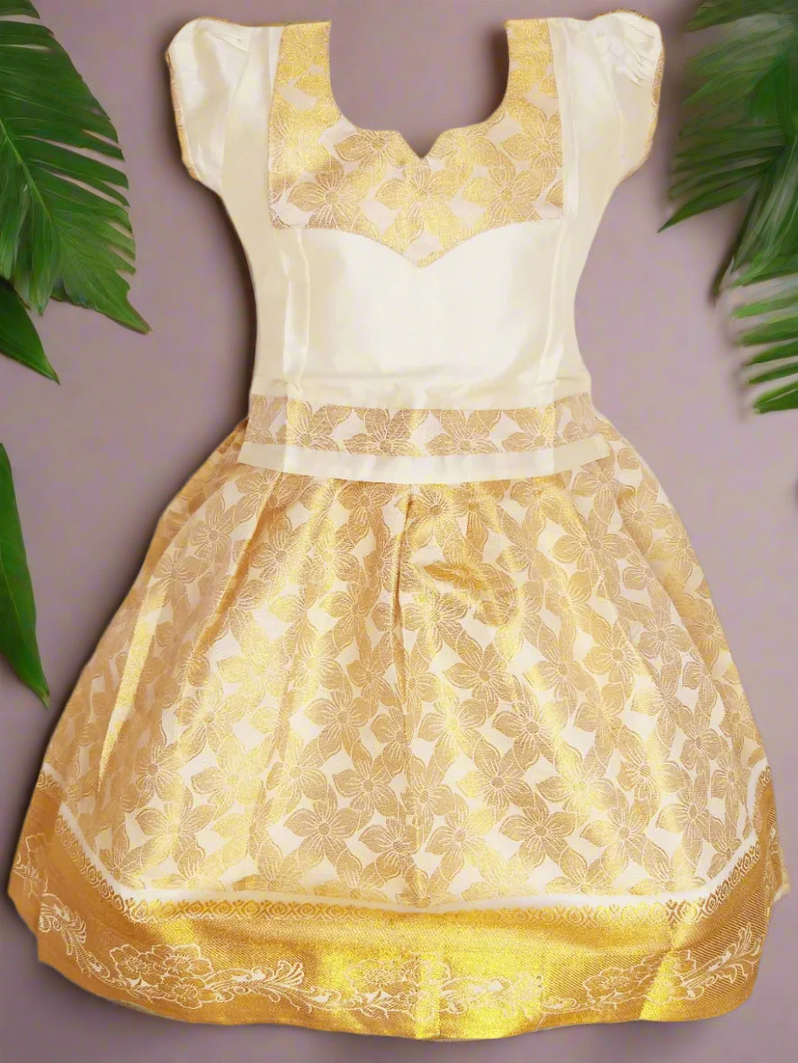 "Girls Kerala Kasavu Pattu Pavadai Set with Golden Zari Floral Pattern – Traditional South Indian Kids Wear"