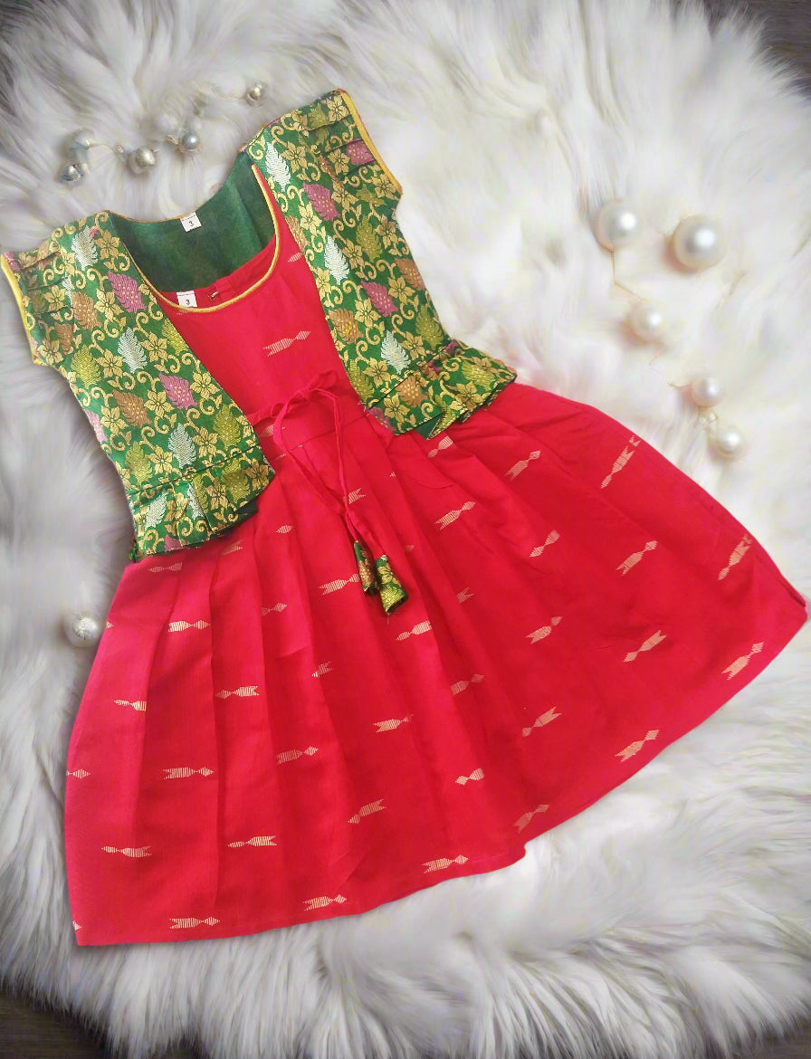 Shop this Red frock with golden arrow motifs and Green brocade jacket for girls. A perfect ethnic outfit for parties, weddings, and festivals