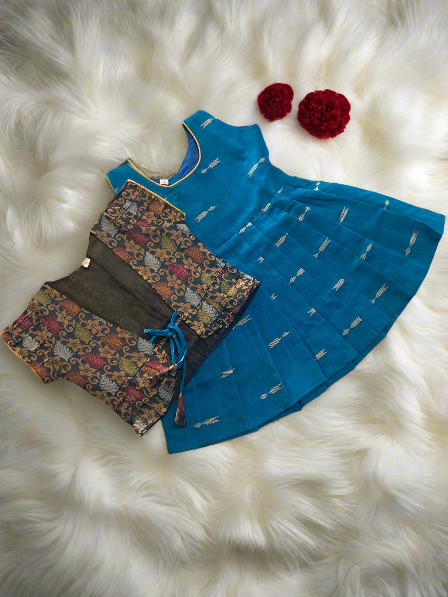 Shop this navy blue frock with golden arrow motifs and pink brocade jacket for girls. A perfect ethnic outfit for parties, weddings, and festivals