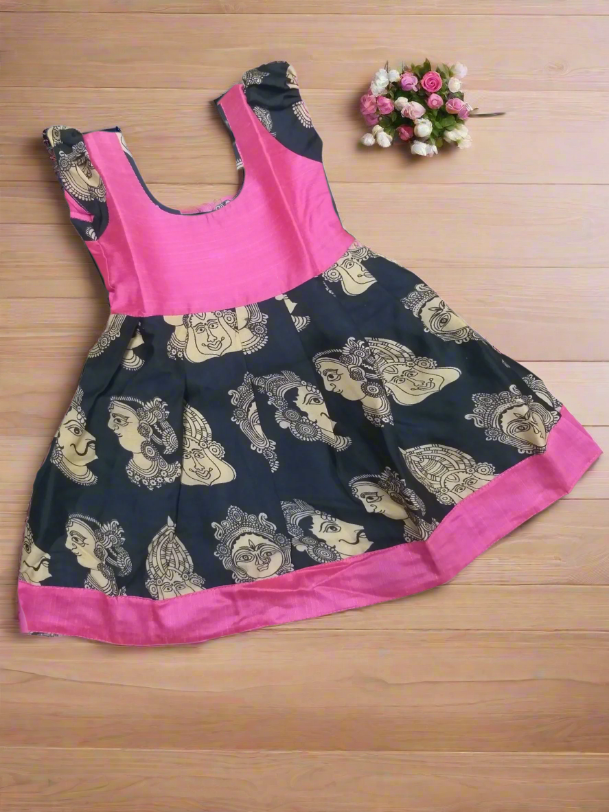 Shop this beautiful Kalamkari cotton frock for girls, featuring a bold Buddha face print and vibrant blue yoke. Ethnic, elegant, and comfortable – perfect for festivals or casual wear.