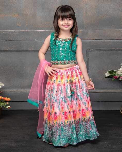 Adorable peach high-low frock for girls featuring puff sleeves and floral rose appliqués – perfect for birthday parties, weddings, and special celebrations.