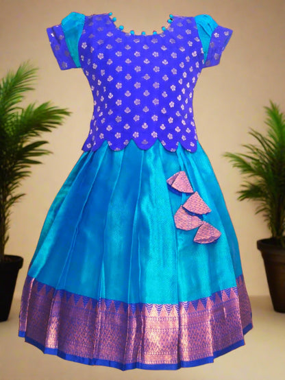 Girls Blue Banarasi muslin pattu pavadai with scallop hem top, potli ball neck design, and tassels – ethnic kids festive wear