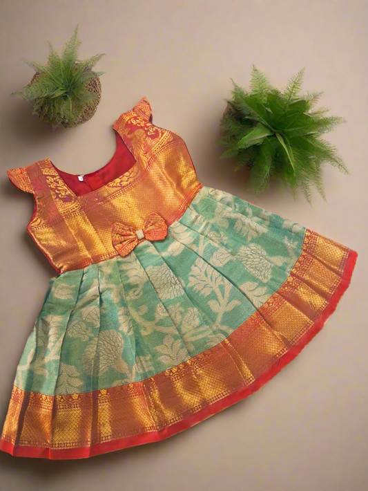 Baby girl traditional Banarasi Jacquard frock with green and gold zari work and red blouse design – festive kids ethnic wear