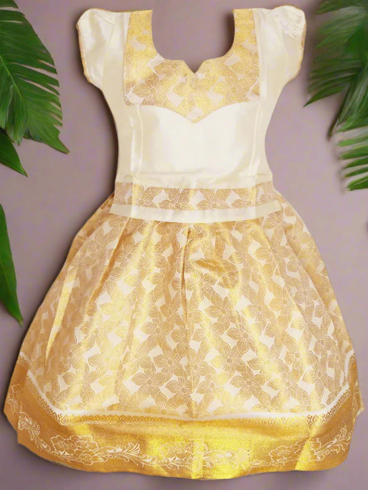 "Girls Kerala Kasavu Pattu Pavadai Set with Golden Zari Floral Pattern – Traditional South Indian Kids Wear"