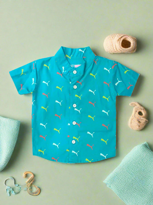 Turquoise children's shirt with colorful Puma logo pattern on a white background