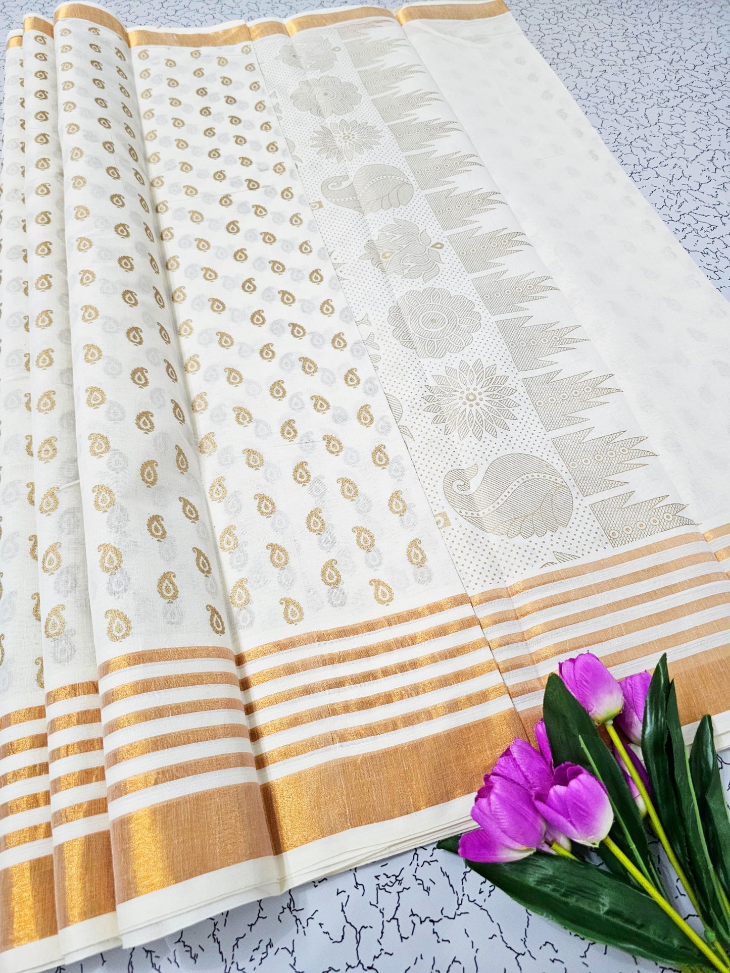 White and gold cotton saree with paisley motifs and striped pallu – traditional South Indian festive wear