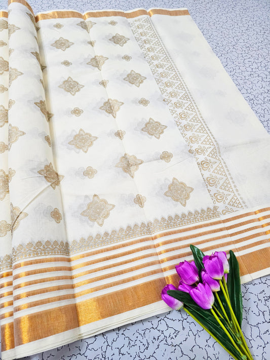 White and gold cotton saree with paisley motifs and striped pallu – traditional South Indian festive wear