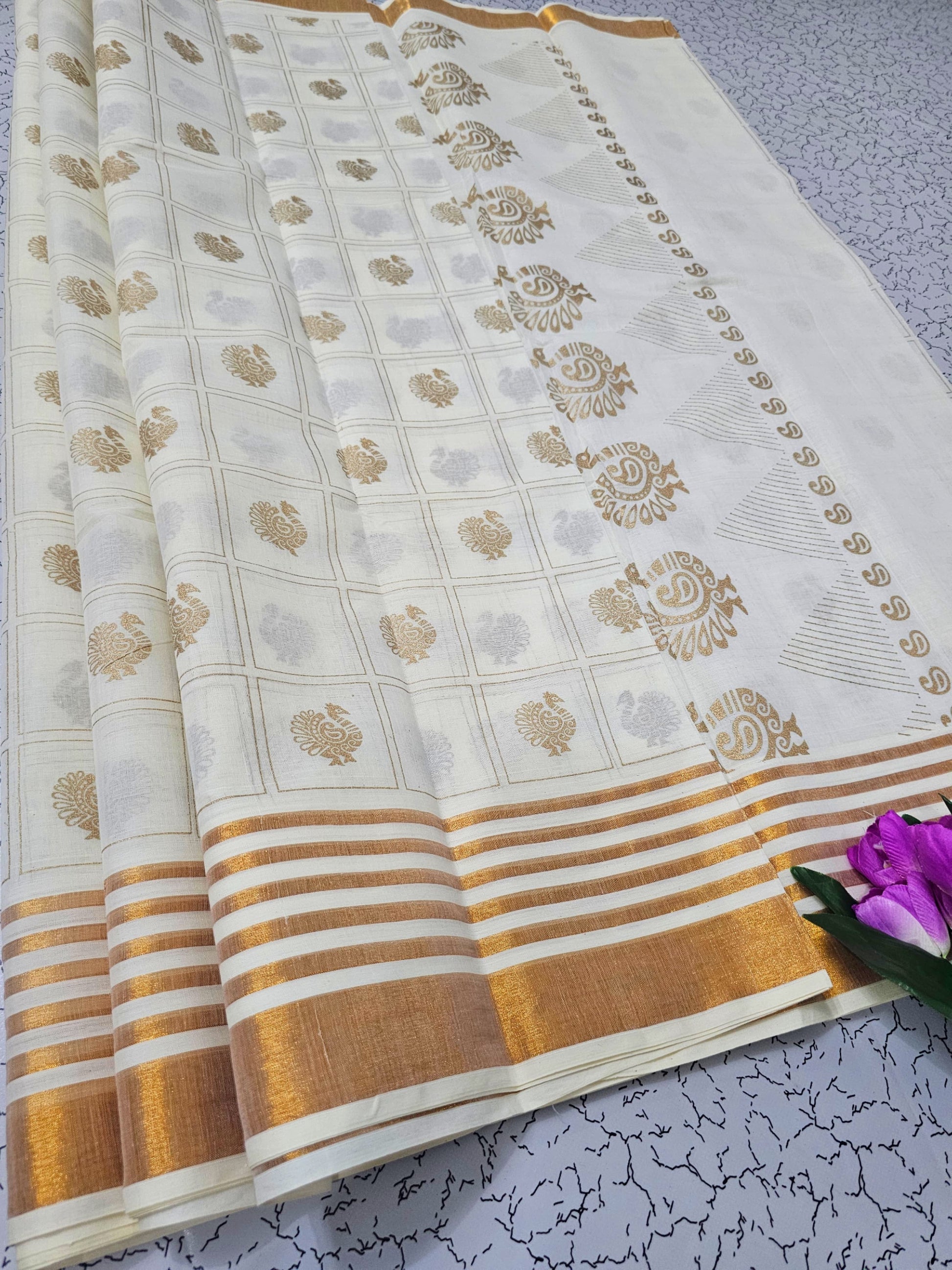 White and gold cotton saree with paisley motifs and striped pallu – traditional South Indian festive wear