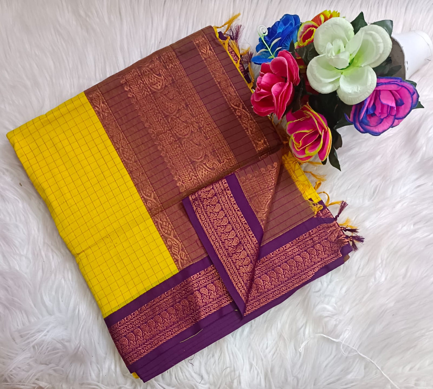 Traditional Yellow Kalyani cotton saree with Purple zari border and checked pattern – lightweight daily wear handloom saree