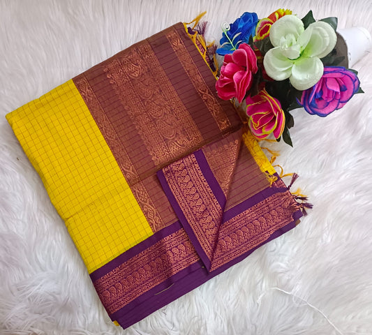Traditional Yellow Kalyani cotton saree with Purple zari border and checked pattern – lightweight daily wear handloom saree